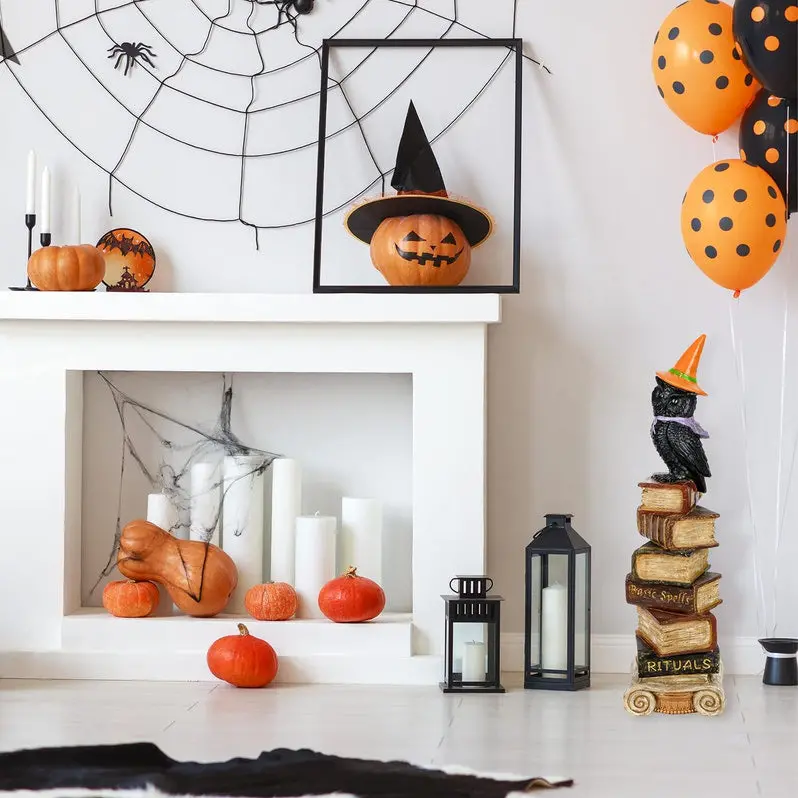 Halloween-Themed Owl Statue Perched on Stack of Books