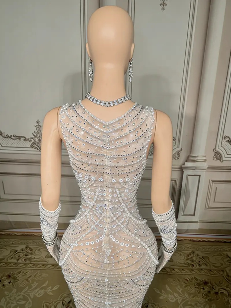 White Beaded Mermaid Gown – High-Neck Sleeveless Design with Dramatic Open Back & Floor-Sweeping Hem